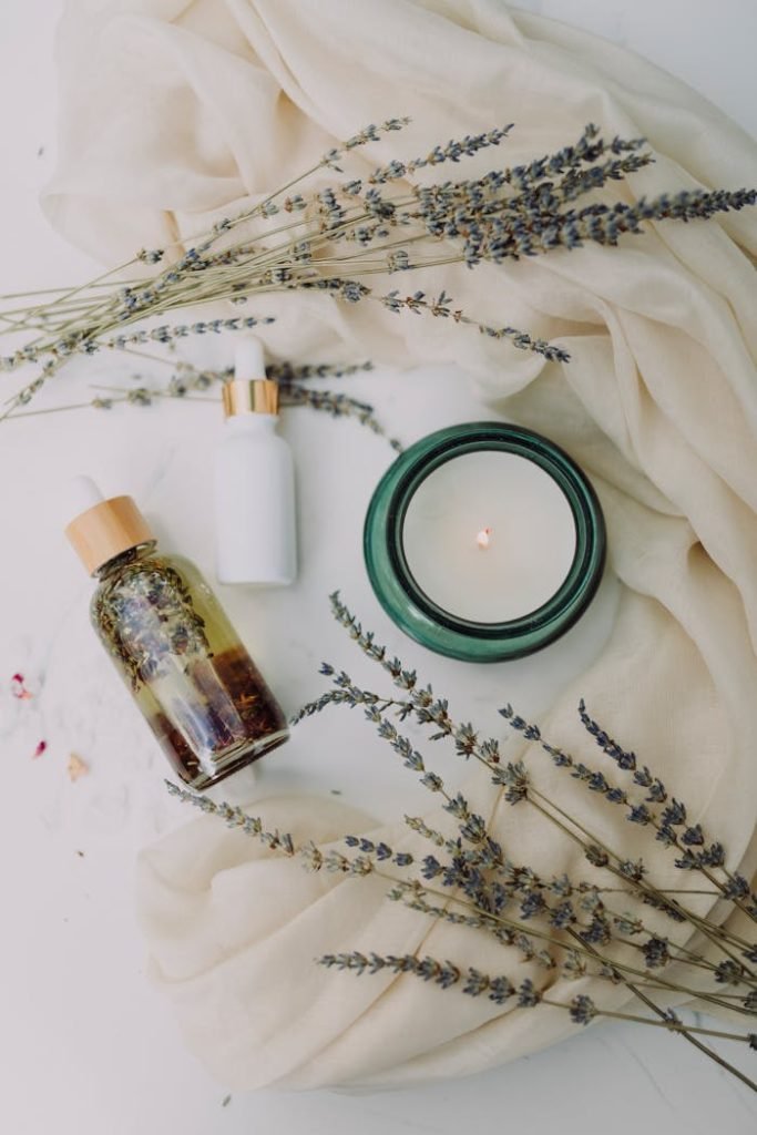white-and-brown-labeled-bottle-6724357 A calming flat lay of spa essentials featuring lavender and candles for relaxation.